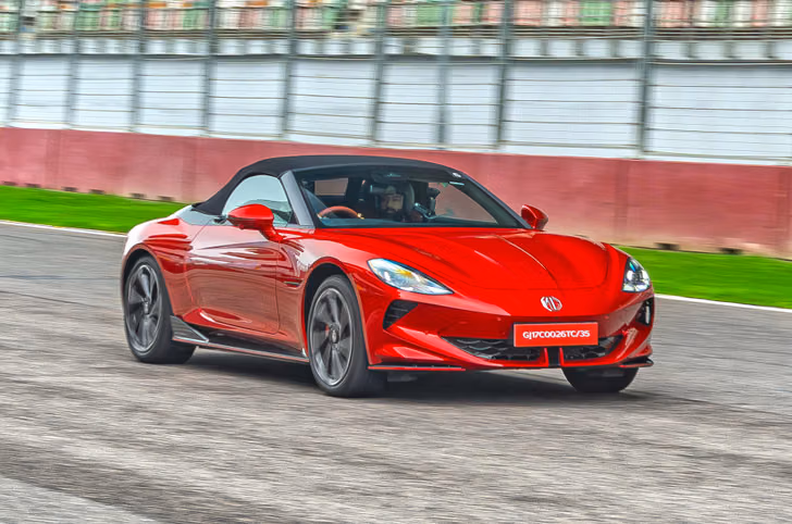 Red MG Cyberster driving on track