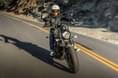 A long wheelbase and stretched stance give it traditional cruiser proportions Kawasaki Vulcan S riding shot